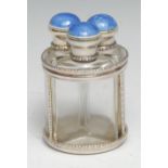 A George V silver and enamel three-section scent bottle stand, each triform perfume flask with