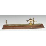 Textiles and the Industrial Revolution - a 19th century brass and mahogany yarn twist tester, by