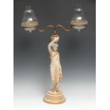 A Royal Worcester figural table lamp, made for Clarke's Cricklite Lamps, she stands wearing