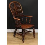 A 19th century elm Windsor elbow chair, hoop back, Christmas tree splat, curved mid rail terminating