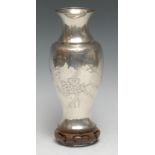 A Chinese silver ovoid vase, engraved with butterflies and blossoming prunus, 19cm high, marked