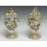 A pair of Coalbrookdale Rococo Revival porcelain potpourri vases, profusely applied with colourful
