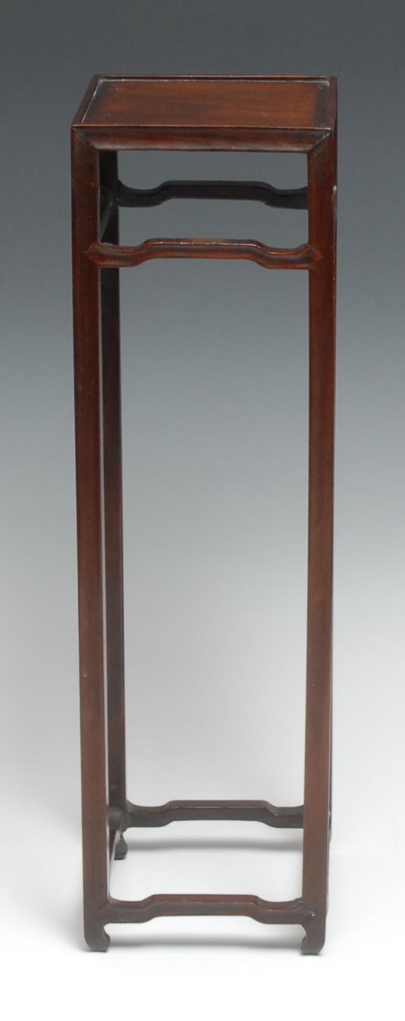 A tall Chinese hardwood table top vase stand, square top with shallow gallery, moulded square