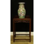 A Chinese hardwood rectangular occasional table, rectangular panel top above a deep frieze,