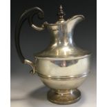 An Edwardian silver hot water jug, half girdle, ebonised scroll handle, button finial, 24cm high,