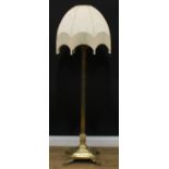 Interior Design - a brass telescopic standard lamp, as a Corinthian column, stepped square base, paw