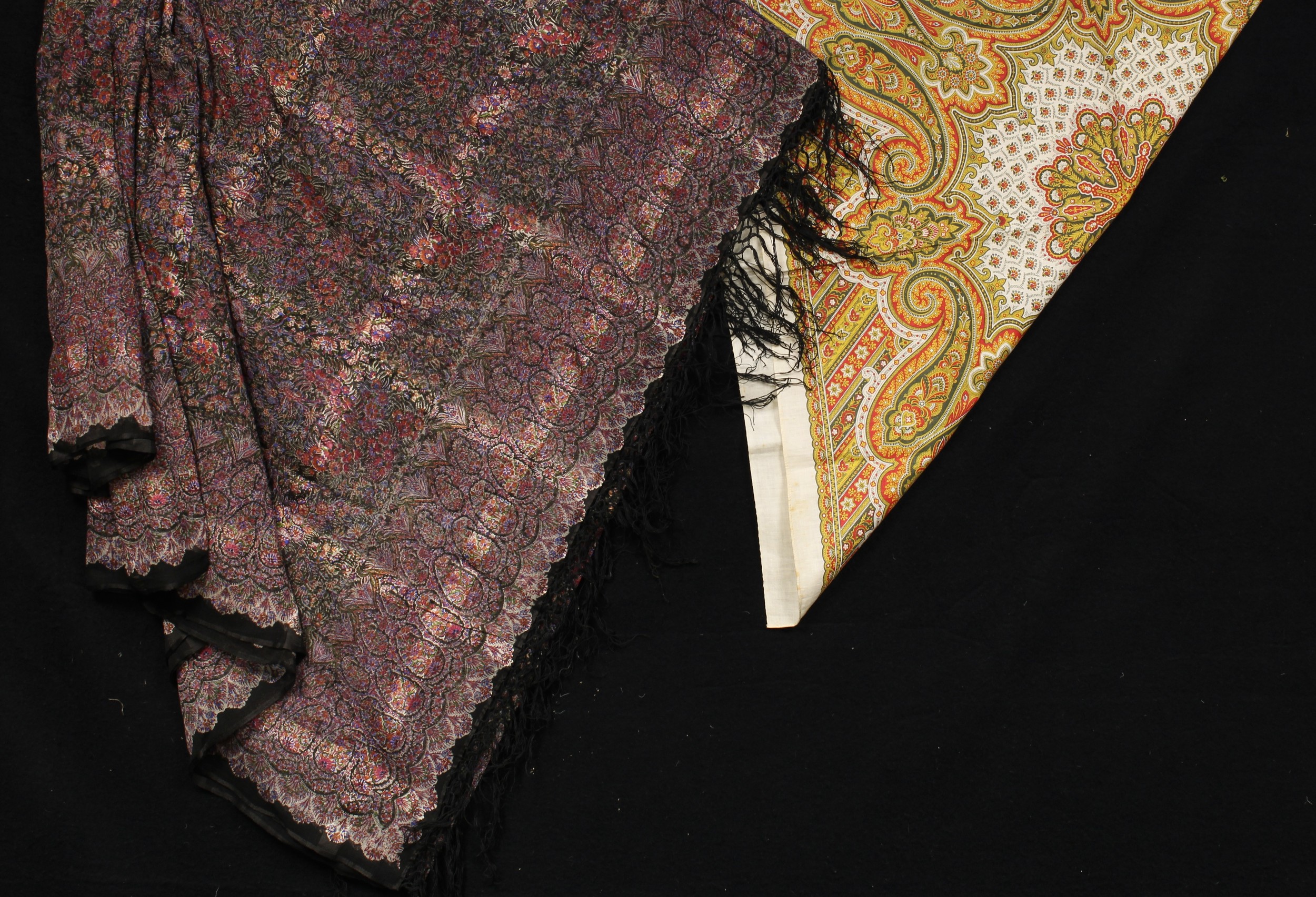 A paisley type shawl, possibly Indian, decorated with a dense pattern of flowers and foliage,