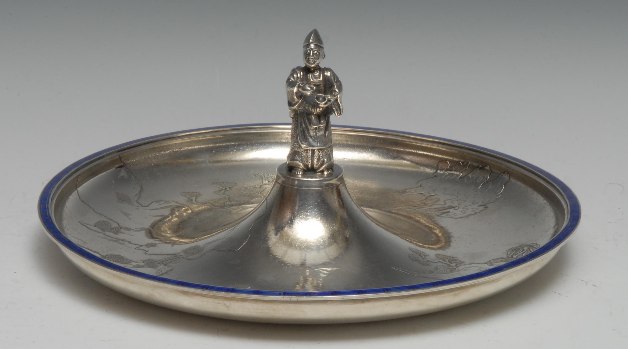 A Japanese silver and enamel circular table centre dish, centred by a cast figure of an elder, the