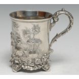 An early Victorian Rococo Revival silver mug, cast with a farmyard, acanthus scroll handle, rocaille