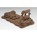 A Black Forest bookslide, the folding ends carved with mountain goats, 32cm wide (closed), c.1870