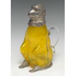 An E.P.N.S and yellow glass novelty claret jug, as a monkey, modelled seated, his head hinged as the