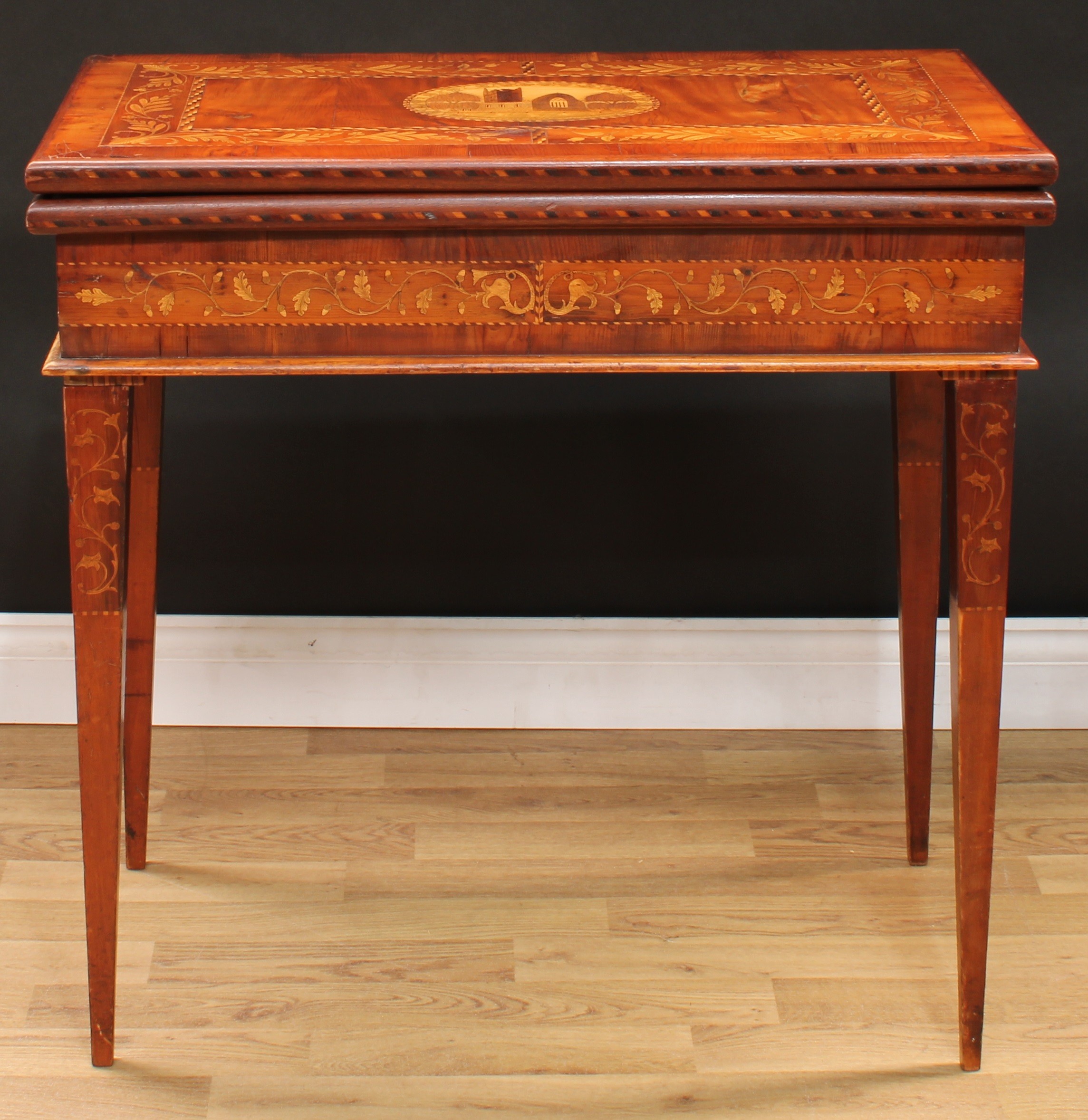A 19th century Irish Killarney marquetry and yew room centre tea or silver table, hinged rectangular