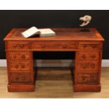 A Victorian walnut twin pedestal writing desk, moulded top with inset tooled and gilt leather