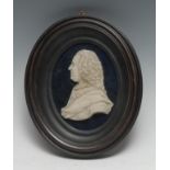 An 18th century wax portrait, King George II, bust length, facing to dexter, 9cm x 7cm, ebonised