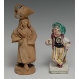 ﻿An Italian majolica novelty figure, of a hunchback chef, modelled by a tree stump, square base