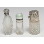 A Victorian silver mounted hobnail-cut glass cylindrical scent bottle, hinged cover chased with