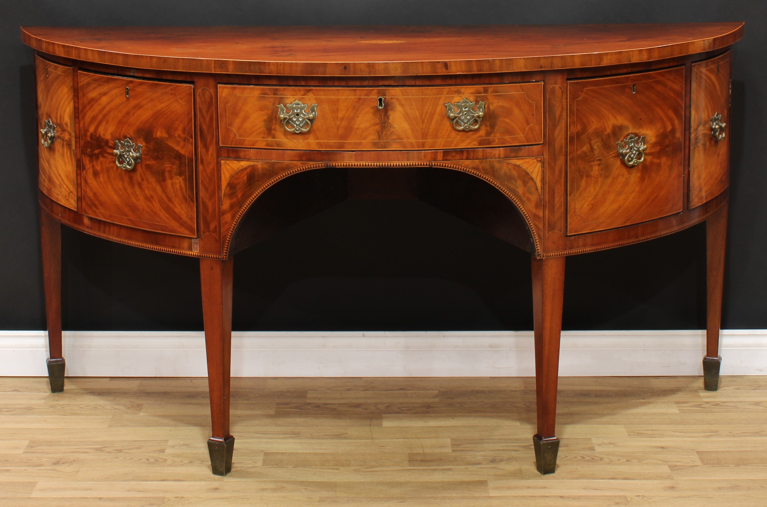 A George III mahogany demilune sideboard or serving table, slightly oversailing top centred by a - Image 2 of 6