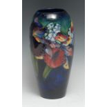 A Moorcroft Iris pattern slender ovoid vase, 25.5cm high, impressed marks, monogrammed, c. 1950