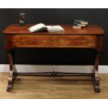 A Regency rosewood and brass marquetry library table, rounded rectangular top above a long frieze