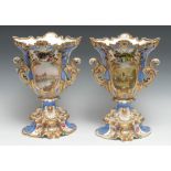 A pair of Thomas Grainger & Co. rococo vases, painted with flowers, the verso with landscapes, the