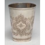 A Persian silver tapered cylindrical beaker, chased with peacocks, lotus and dense stylised