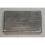 A George IV silver rectangular snuff box, engine turned overall, hinged cover centred by a