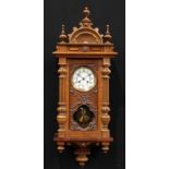 A 19th century walnut Vienna wall clock, by Lucca, 13cm enamel dial inscribed with Roman numerals,