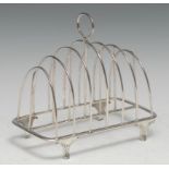 A George III Scottish silver seven-bar toastrack, loop handle, graduated arched divisions,