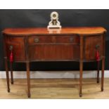 A 19th century mahogany inverted break-centre sideboard, slightly oversailing top with nulled edge