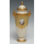 A Coalport slender ovoid jewelled vase and cover, panted with a landscape in oval cartouche, gilt