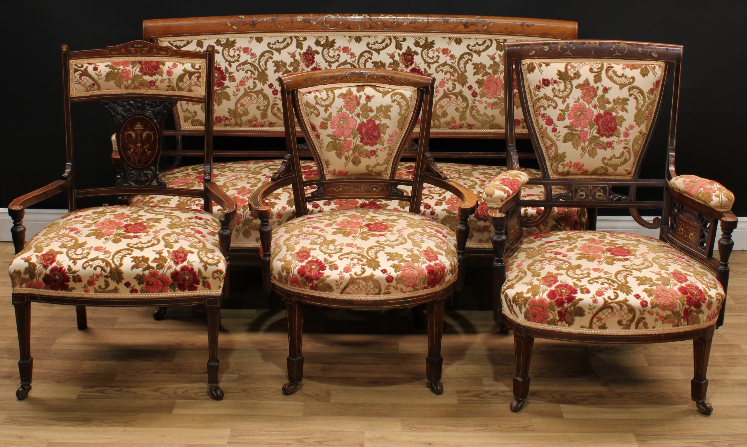 A late Victorian rosewood and marquetry four-piece drawing room suite, comprising a sofa, 85.5cm