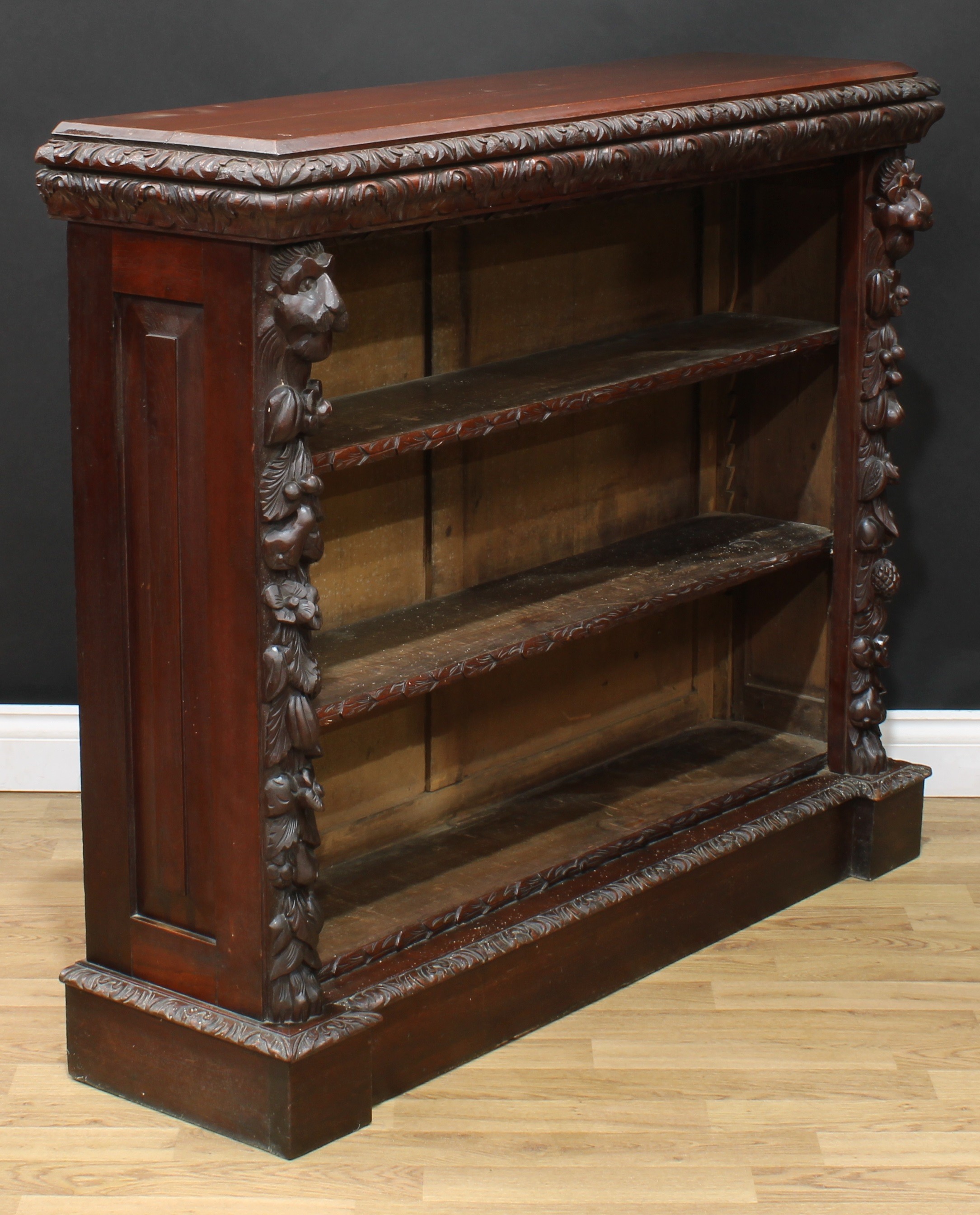 A late Victorian oak library open bookcase, rectangular top with leafy moulded edge above two - Image 3 of 5