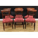 A set of six Regency rosewood bar-back dining chairs, each with a curved cresting rail, stuffed-over