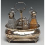 A George III silver boat shaped cruet stand, gadrooned borders, paw feet, 20cm long, London 1814