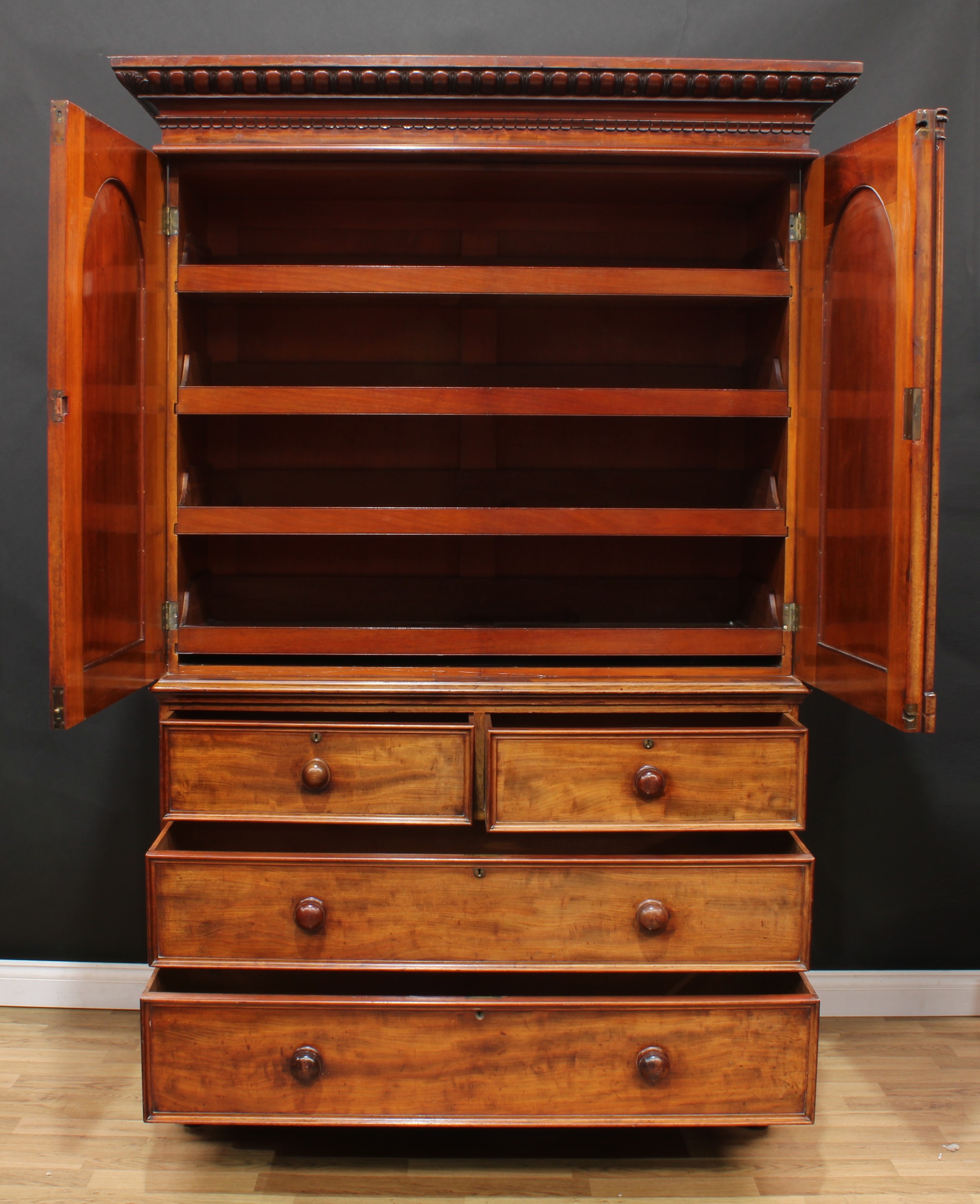 A William IV mahogany linen press, outswept egg-and-dart cornice above a pair of arched panel - Image 3 of 3