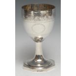 A George III silver pedestal goblet, bright-cut engraved with flowers, scrolling leaves and