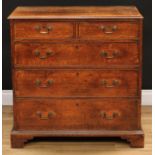 A George III oak chest, rectangular top with moulded edge above two short and three long graduated