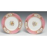 A pair of Coalport shaped circular plates, painted by Wm Cook, with summer flowers, the rim with