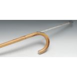 An early 20th century horse measuring walking stick, the bamboo cane enclosing a scale, curved
