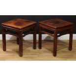 A pair of Chinese hardwood floor-vase stands, panel tops, shaped friezes, square section legs carved