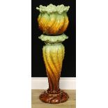 A Leeds Art Pottery jardinière and stand, moulded with scrolling acanthus, 87cm high, impressed