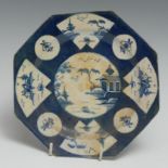 A Worcester octagonal plate, painted with central landscape with alternating fan and roundel
