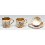 A Royal Worcester cabinet coffee cup and saucer, painted with pink cabbage roses, gilt interior,