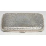 A Victorian silver rounded rectangular cigar case, engraved overall with scrolling foliage, sprung