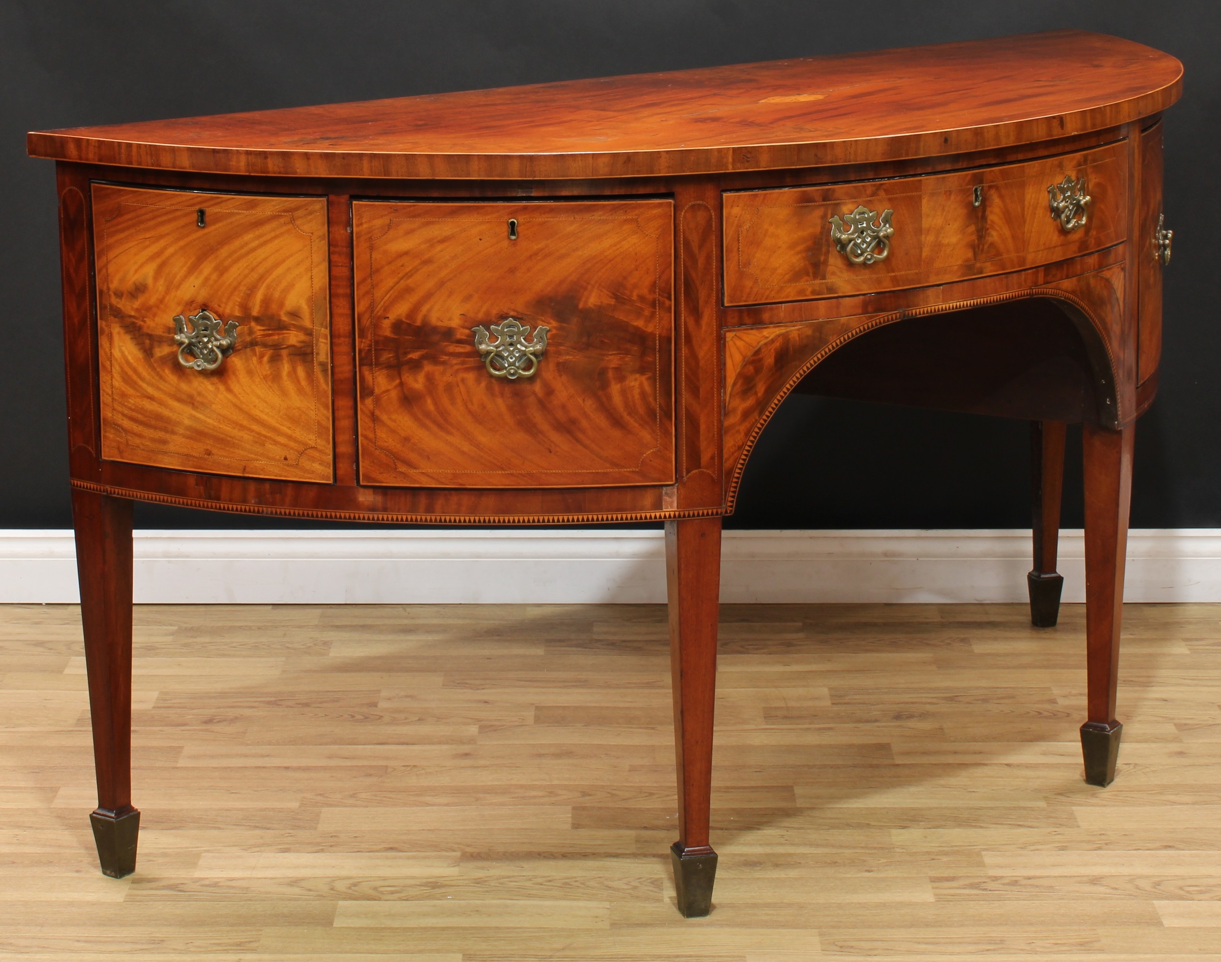 A George III mahogany demilune sideboard or serving table, slightly oversailing top centred by a - Image 4 of 6