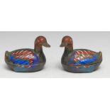 A pair of Chinese cloisonne enamel boxes and covers, as ducks, brightly decorated in polychrome,