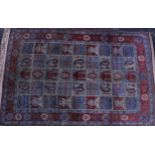 A Bakhtiari carpet, Persian, the field with nine rows of five squares each with stylised foliage, in