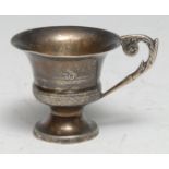 A 19th century Continental silver toy miniature campana cup, leafy scroll handle, 4cm high,