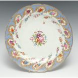 A Nantgarw shaped circular plate, painted with a central floral spray, the border with trailing