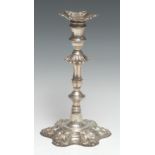 A George III cast silver table candlestick, of seamed construction, detachable nozzle, knopped stem,